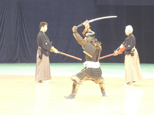Kenjutsu; in the background with fukuro shinai and in the foreground with an o-dachi