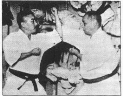 Yasuhiro Konishi (L) training with Motobu